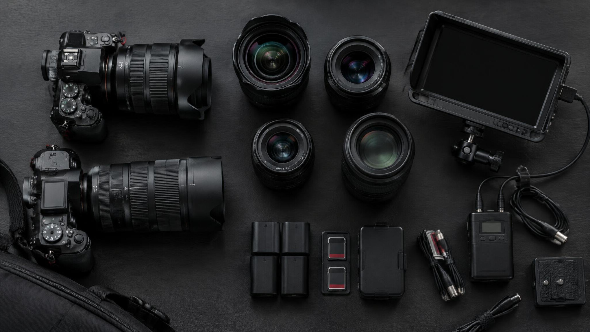 Vintage and modern cameras laid out
